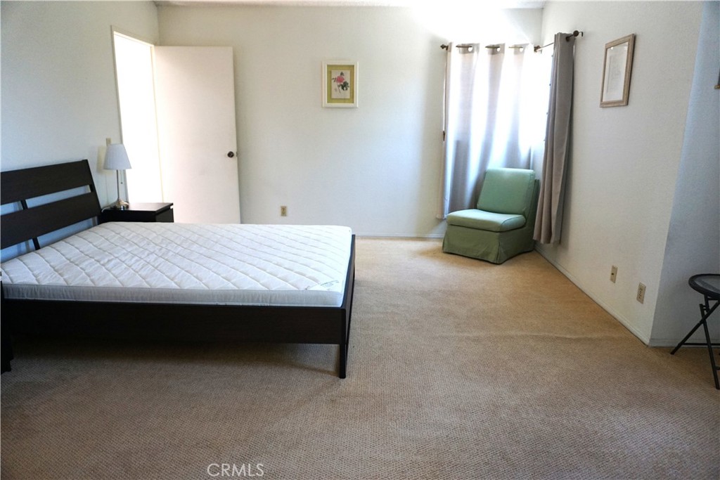 1604 Vía Rosa Baldwin Park, CA 91706 - Photo 12 of 27 a bed room with a bed and a chair