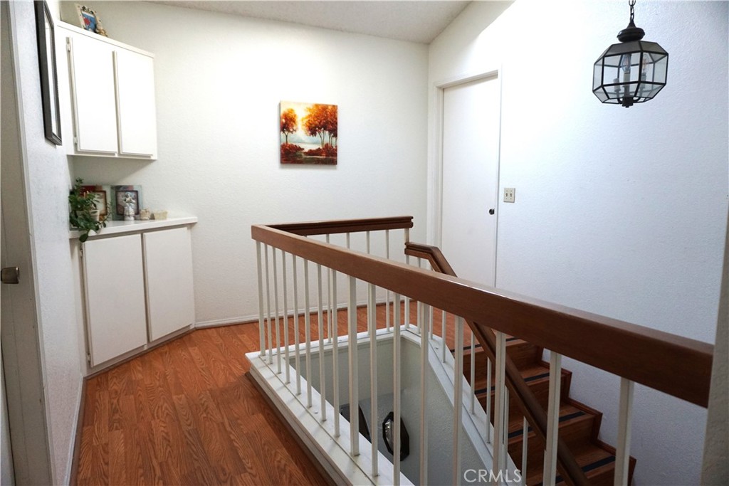 1604 Vía Rosa Baldwin Park, CA 91706 - Photo 7 of 27 a view of staircase with wooden floor and white walls