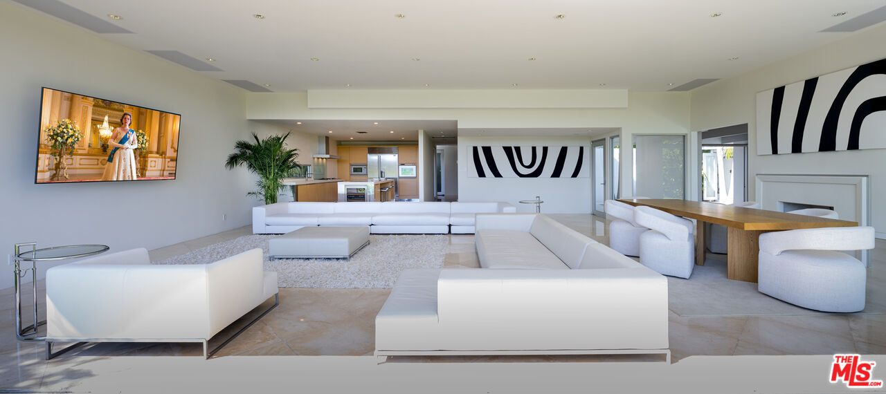 1466 Bel Air Road Los Angeles, CA 90077 - Photo 2 of 35 a living room with furniture and a potted plant