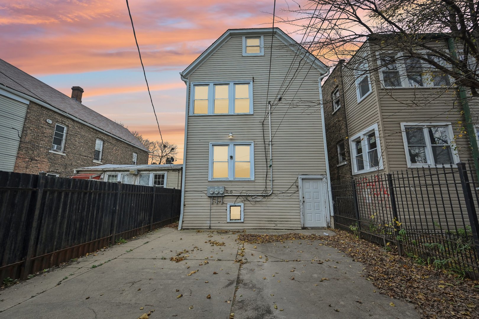 3140 West Pershing Road Chicago, IL 60632 - Photo 2 of 65 a front view of a house with a yard