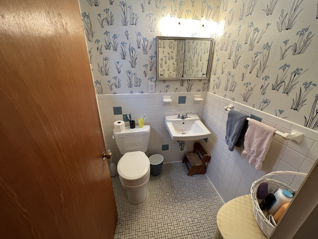 7 Johnson Road Sharon, MA 02067 - Photo 12 of 26 a bathroom with a toilet and a sink