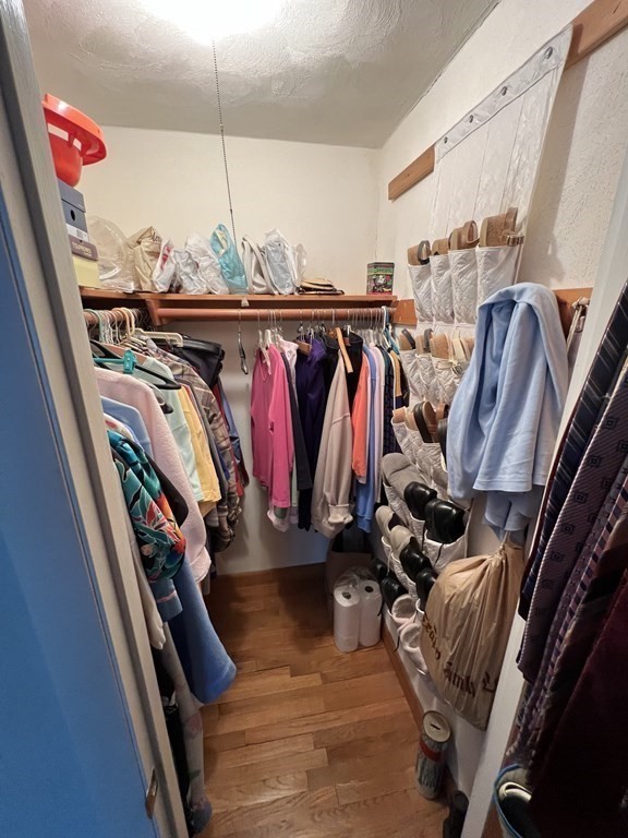 7 Johnson Road Sharon, MA 02067 - Photo 13 of 26 a view of walk in closet with clothes