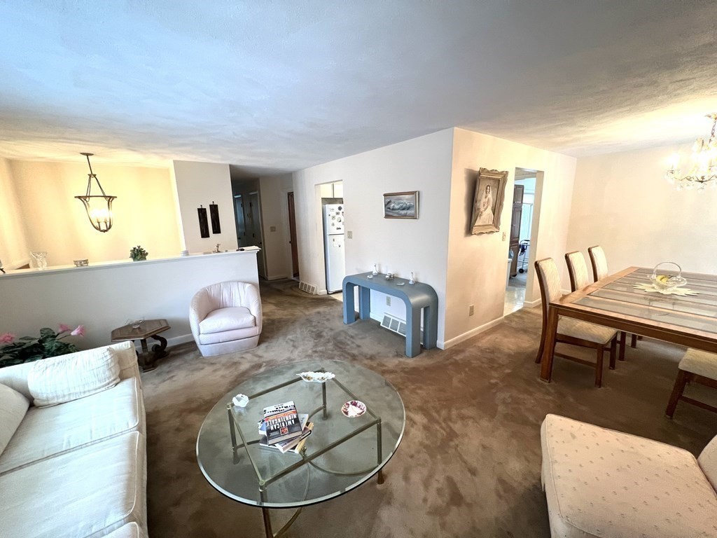 7 Johnson Road Sharon, MA 02067 - Photo 4 of 26 a living room with furniture and a wooden floor