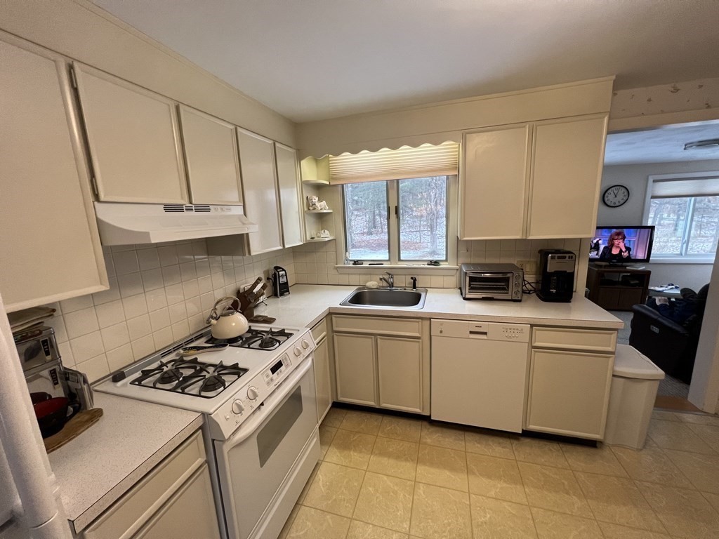 7 Johnson Road Sharon, MA 02067 - Photo 5 of 26 a kitchen with a stove a sink and a cabinets