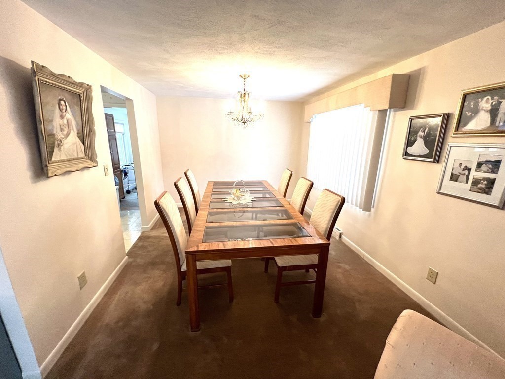 7 Johnson Road Sharon, MA 02067 - Photo 8 of 26 a view of a dining room with furniture and wooden floor