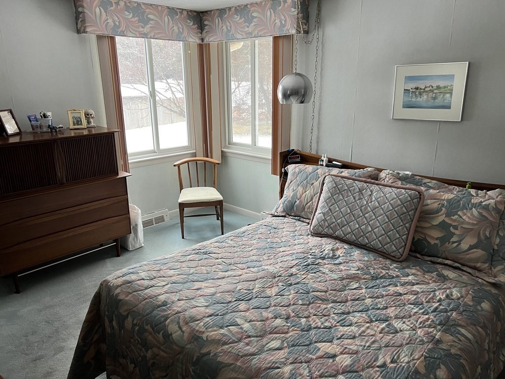 7 Johnson Road Sharon, MA 02067 - Photo 10 of 26 a bedroom with a bed and window