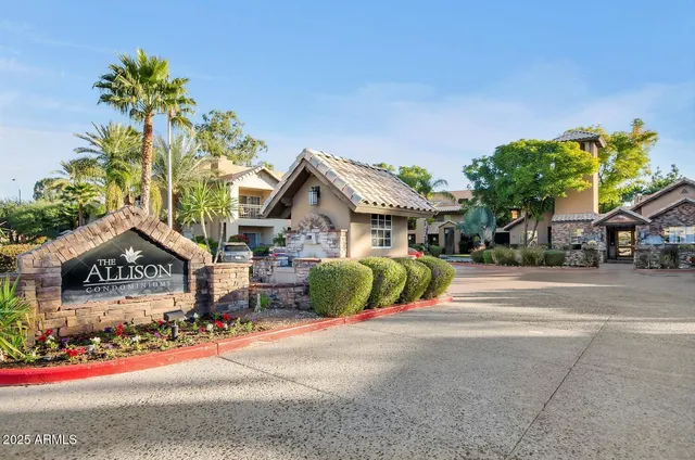 a front view of a house with a yard and outdoor seating