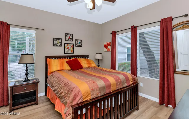 a bedroom with bed and a window