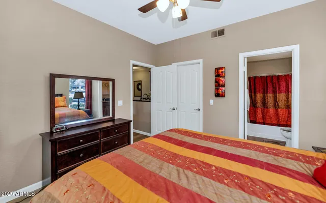 a bedroom with a bed and a dresser