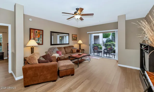 a living room with furniture and a large window
