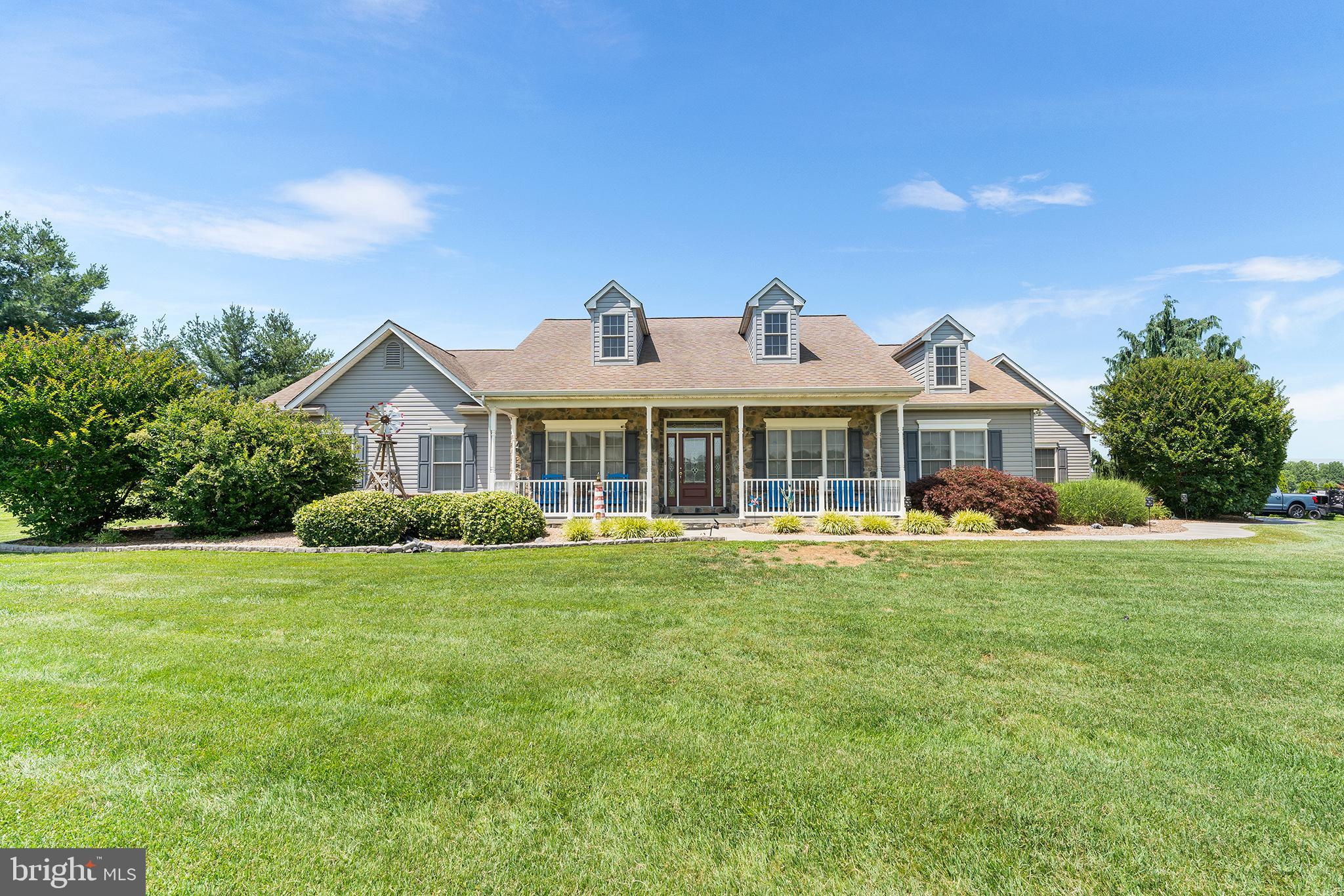 83 Rolling Green Lane Elkton, MD 21921 - Photo 1 of 25 a front view of a house with a garden