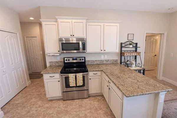 a kitchen with a stove and a sink