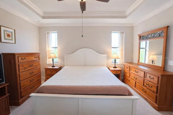 a bedroom with a bed and a dresser