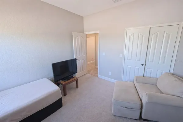 a room with a bed and furniture