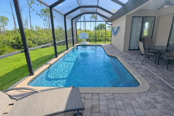 a view of swimming pool with a yard
