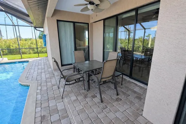 a view of a dining room with furniture window and outside view