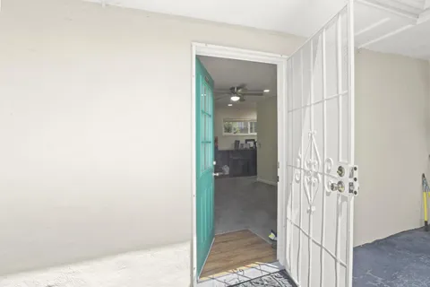 a bathroom with a glass door shower and a sink