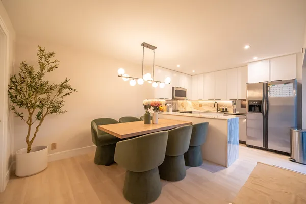 a kitchen with a sink appliances and cabinets
