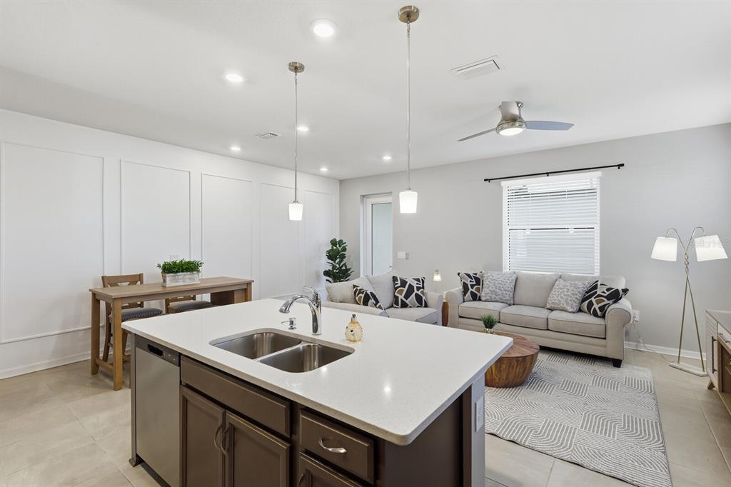 1782 Spreader Lane Sarasota, FL 34240 - Photo 11 of 38 a kitchen with a stove a sink and a refrigerator