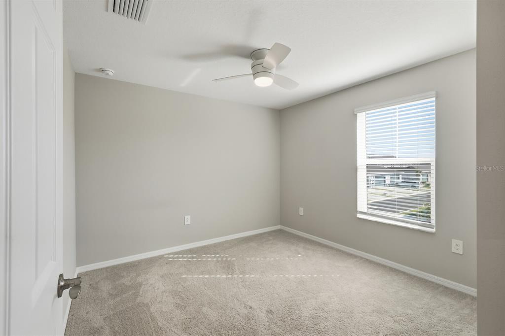 1782 Spreader Lane Sarasota, FL 34240 - Photo 20 of 38 a view of an empty room with a window