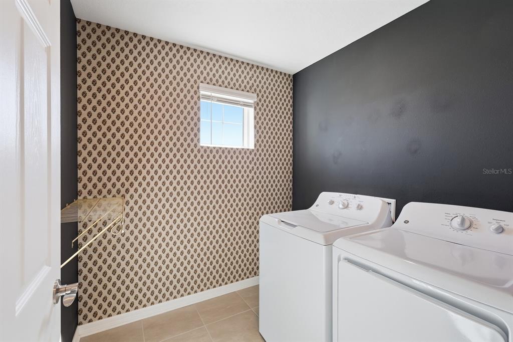 1782 Spreader Lane Sarasota, FL 34240 - Photo 24 of 38 a utility room with dryer and washer