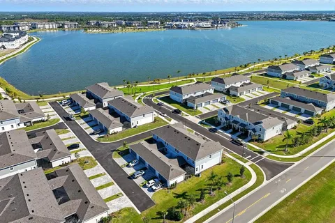 an aerial view of a house with a lake view