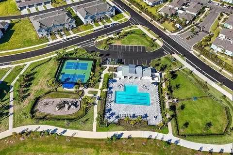 a view of a hallway with staircase and white walls