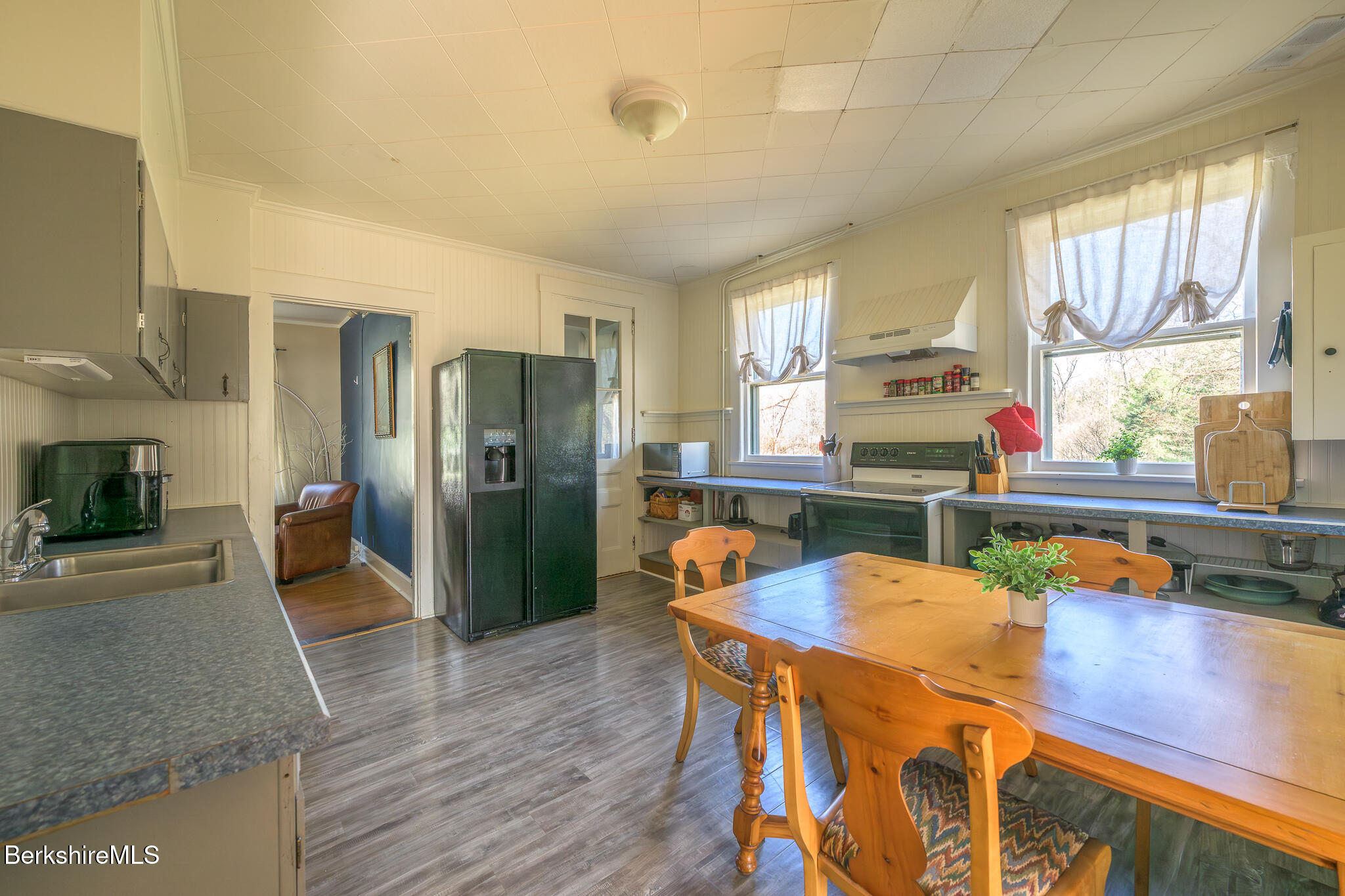 6 East Street Stockbridge, MA 01262 - Photo 12 of 23 a kitchen with stainless steel appliances granite countertop a refrigerator a stove and a wooden cabinets
