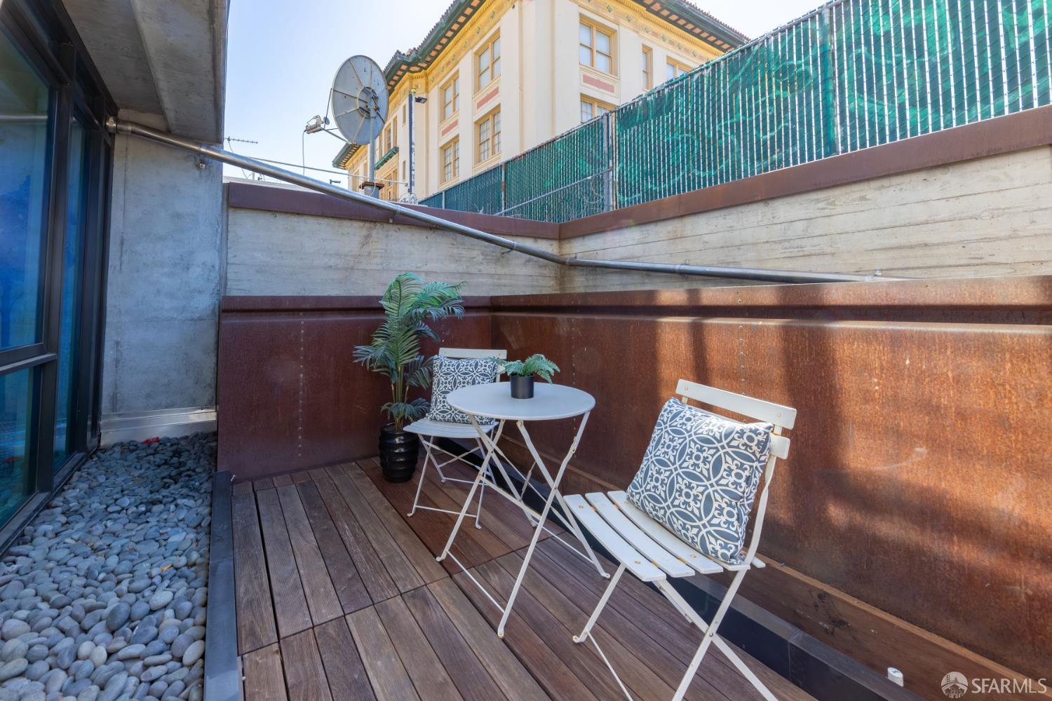 338 Potrero Avenue, Unit 206 San Francisco, CA 94103 - Photo 12 of 22 a view of chair and table in the balcony