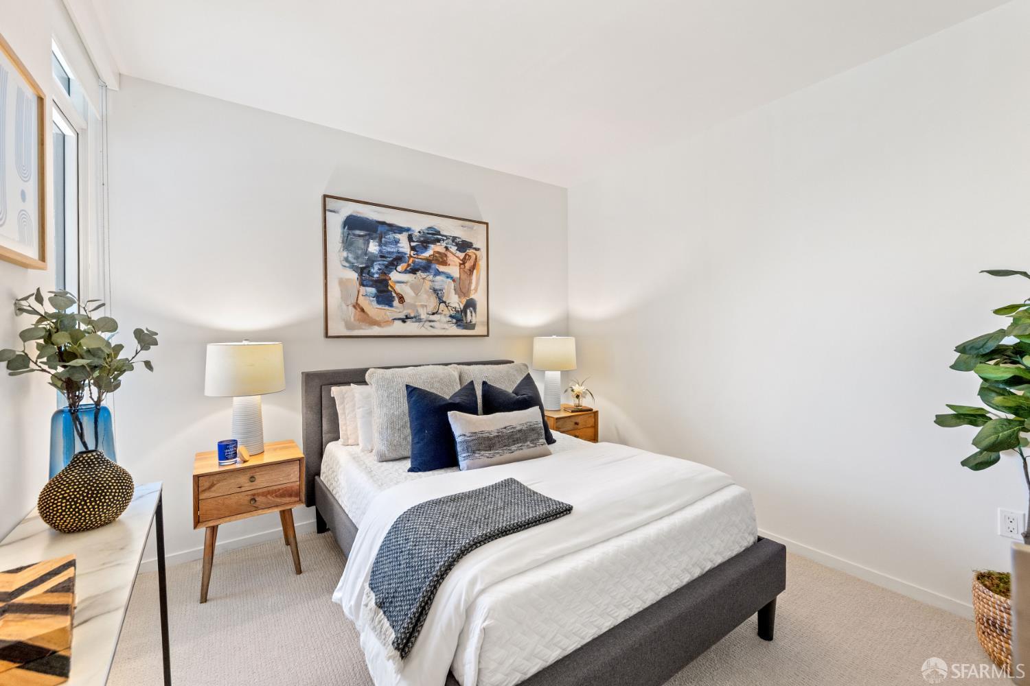 338 Potrero Avenue, Unit 206 San Francisco, CA 94103 - Photo 13 of 22 a bedroom with a bed and a potted plant