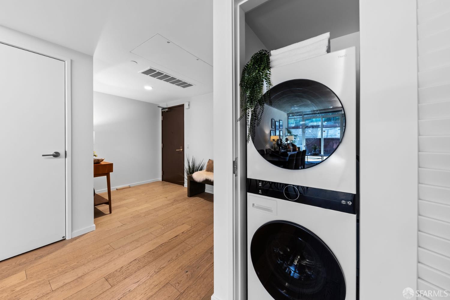 338 Potrero Avenue, Unit 206 San Francisco, CA 94103 - Photo 15 of 22 a view of a livingroom with washer and dryer
