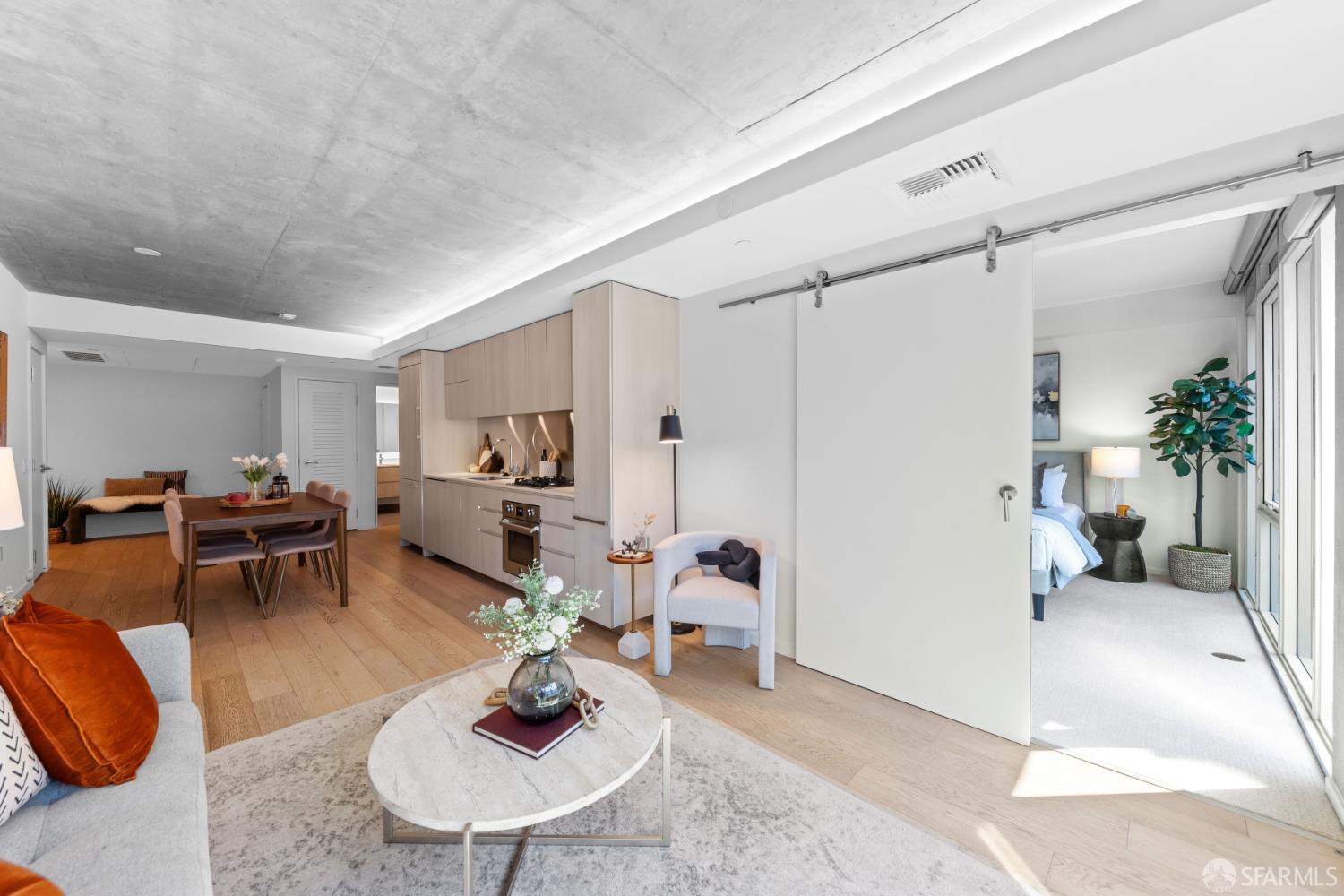 338 Potrero Avenue, Unit 206 San Francisco, CA 94103 - Photo 7 of 22 a living room with furniture or couch and a dining table