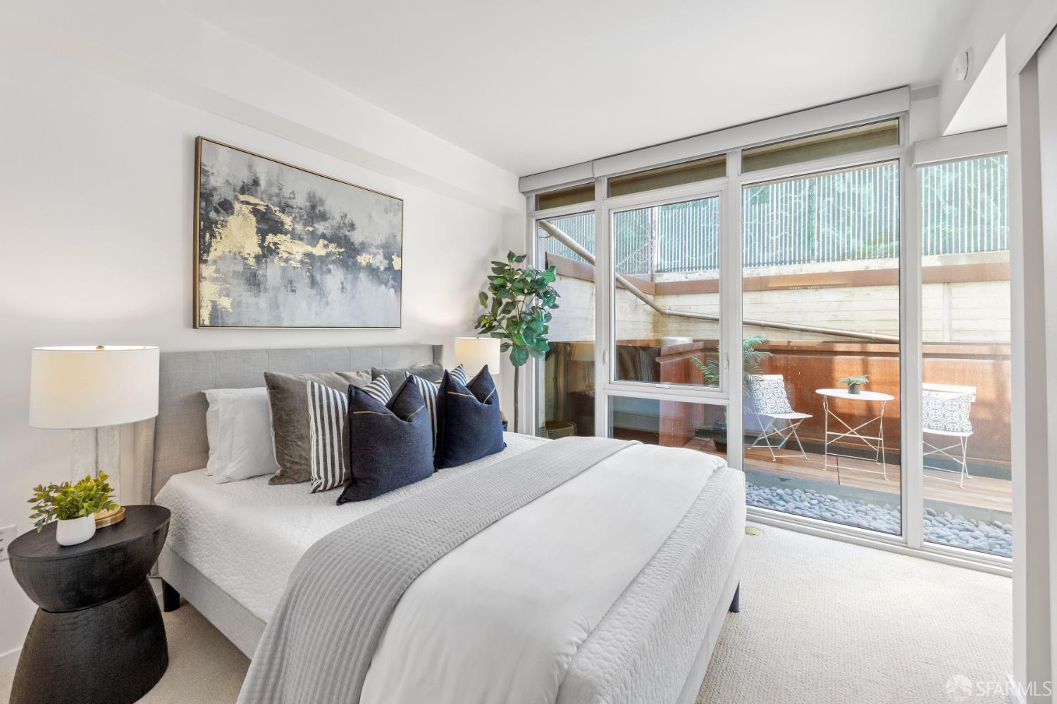 338 Potrero Avenue, Unit 206 San Francisco, CA 94103 - Photo 9 of 22 a bedroom with bed and a large window