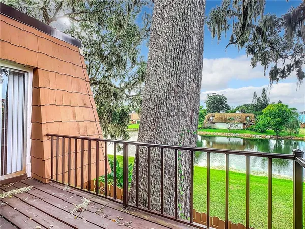 a view of a balcony with wooden floor