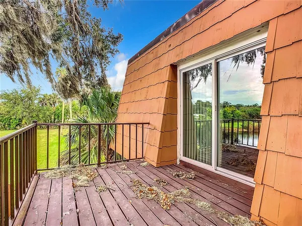 a view of balcony with wooden floor
