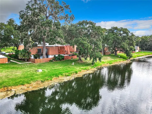 a view of a lake with a house in the background