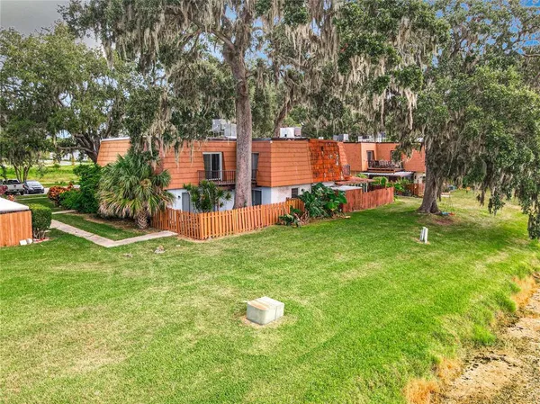 a view of a backyard with swimming pool