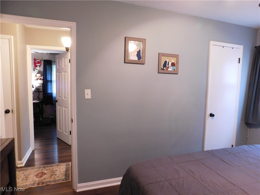 9720 West Ridgewood Drive Parma Heights, OH 44130 - Photo 22 of 46 Bedroom with rich wood finished flooring and baseboards
