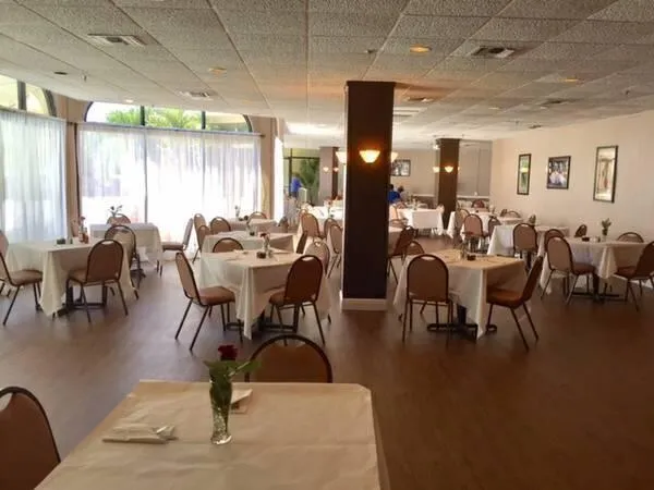 a view of a dining room with furniture window and outside view