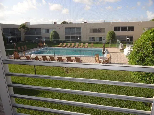 a view of a building from a big yard