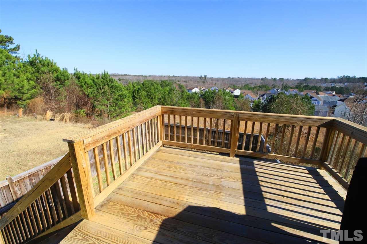 3453 Kernstown Drive Raleigh, NC 27610 - Photo 11 of 21 a view of balcony with wooden floor and fence