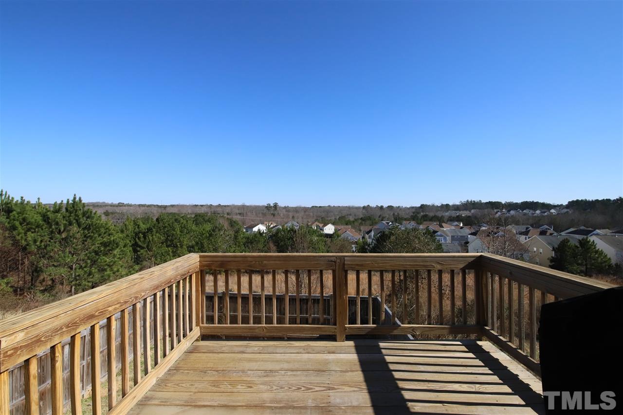 3453 Kernstown Drive Raleigh, NC 27610 - Photo 12 of 21 a view of balcony with wooden floor and fence