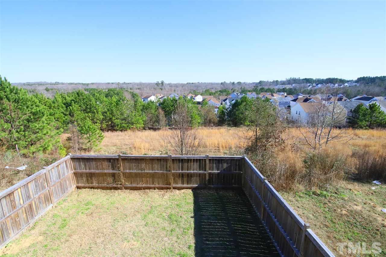 3453 Kernstown Drive Raleigh, NC 27610 - Photo 13 of 21 a view of balcony with wooden floor and fence