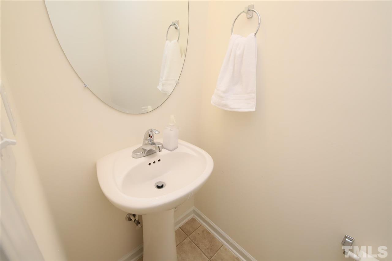 3453 Kernstown Drive Raleigh, NC 27610 - Photo 16 of 21 a bathroom with a sink and a mirror