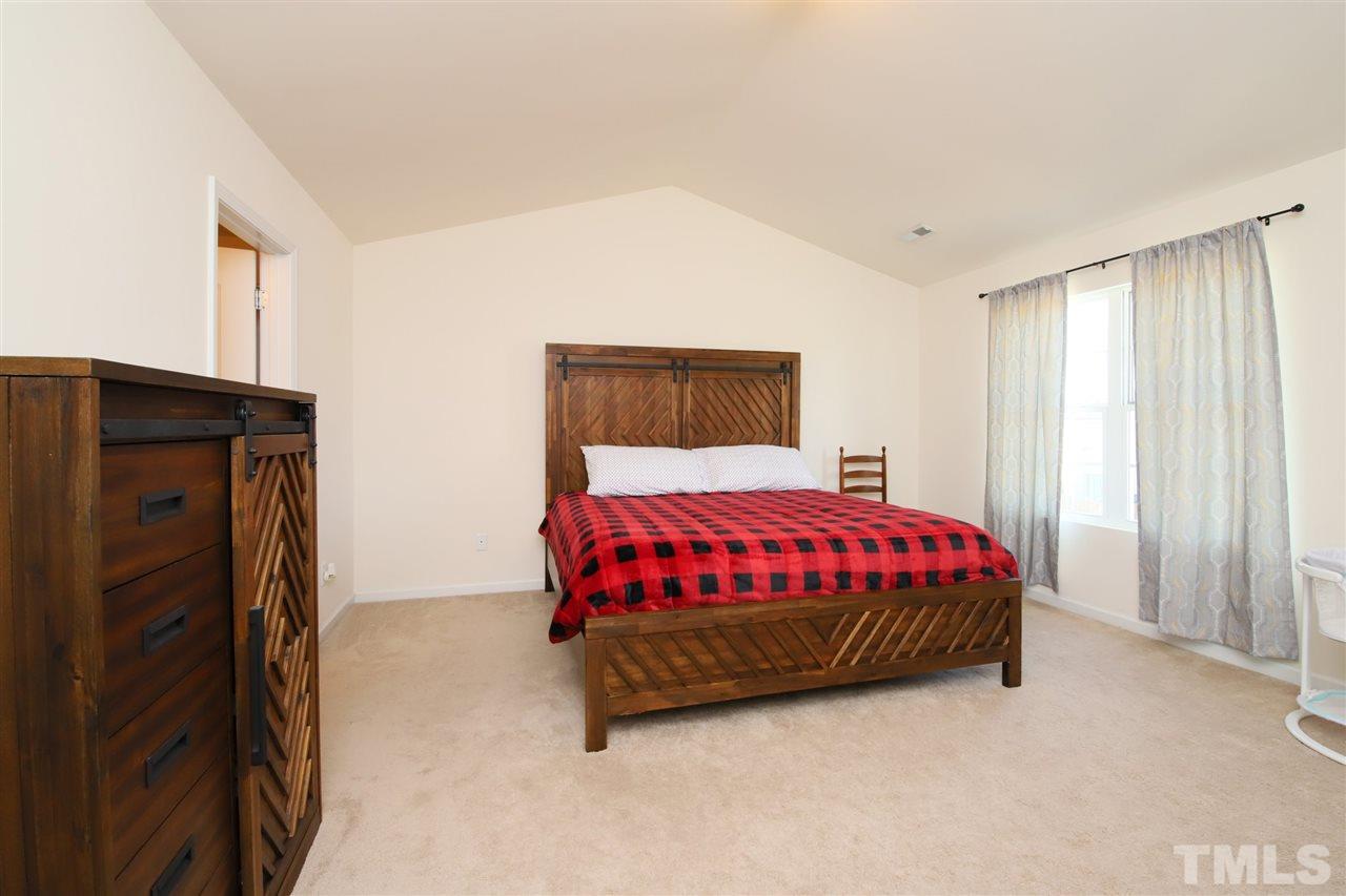 3453 Kernstown Drive Raleigh, NC 27610 - Photo 17 of 21 a spacious bedroom with a bed and a window