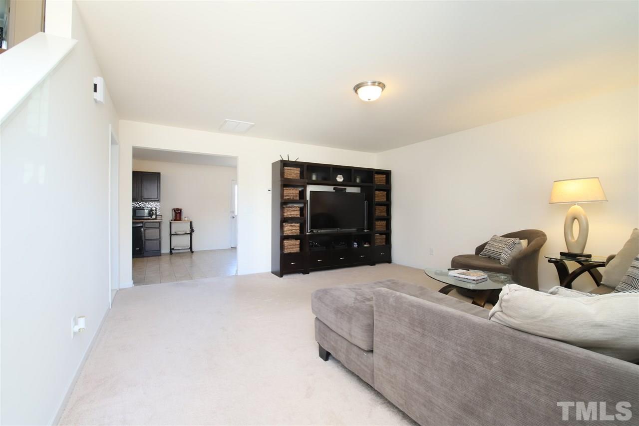 3453 Kernstown Drive Raleigh, NC 27610 - Photo 5 of 21 a bedroom with bed and a large mirror