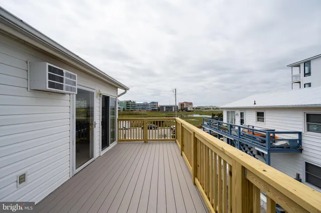 a view of a balcony with stainless steel appliances