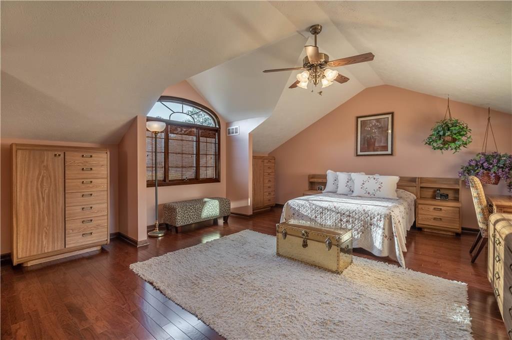 106 Roundtable Drive McMurray, PA 15317 - Photo 12 of 25 a spacious bedroom with a bed and a chandelier