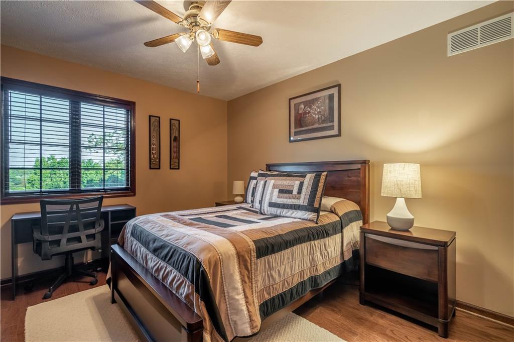 106 Roundtable Drive McMurray, PA 15317 - Photo 15 of 25 a bedroom with a bed and a chandelier