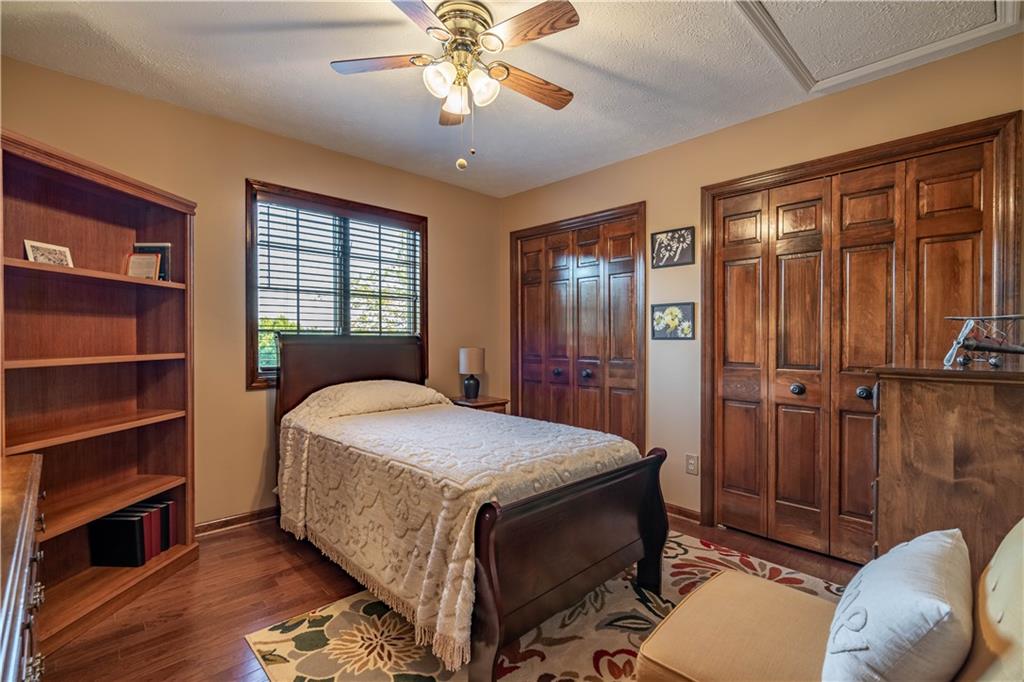 106 Roundtable Drive McMurray, PA 15317 - Photo 17 of 25 a bedroom with a bed and a chandelier